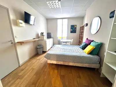 Un ou plusieurs lits dans un hébergement de l'établissement Beau Studio 2 en Centre Ville de Niort au calme proche Gare