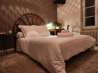 Un ou plusieurs lits dans un hébergement de l'établissement Hôtel et Restaurant Les2M