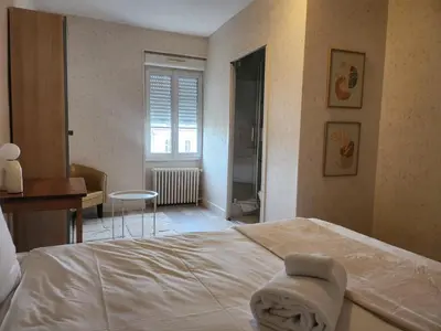 Un ou plusieurs lits dans un hébergement de l'établissement Hôtel et Restaurant Les2M
