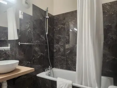 Salle de bains dans l'établissement Hôtel et Restaurant Les2M
