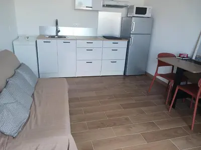 Cuisine ou kitchenette dans l'établissement Logement individuel T2