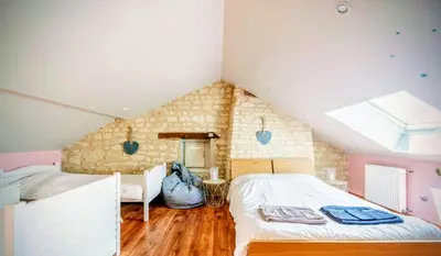 Un ou plusieurs lits dans un hébergement de l'établissement La chambre de la tour