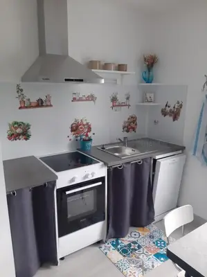 Cuisine ou kitchenette dans l'établissement La Maison d'à côté