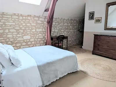 Un ou plusieurs lits dans un hébergement de l'établissement Gite au Château de la Tour à 15 minutes du Futuroscope