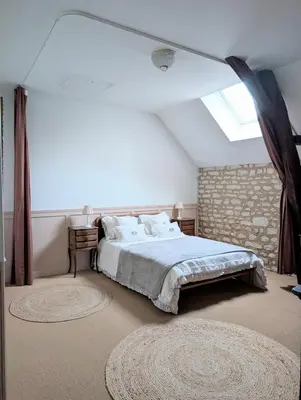 Un ou plusieurs lits dans un hébergement de l'établissement Gite au Château de la Tour à 15 minutes du Futuroscope