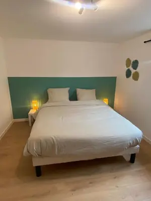 Un ou plusieurs lits dans un hébergement de l'établissement La maison Callinora