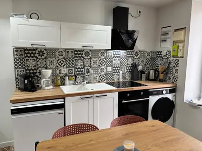 Cuisine ou kitchenette dans l'établissement Maison avec courette