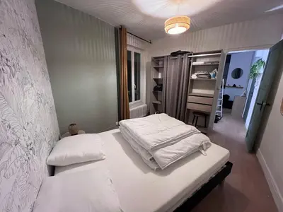 Un ou plusieurs lits dans un hébergement de l'établissement Appartement cosy 2 pieces hyper centre ville Place de la Breche