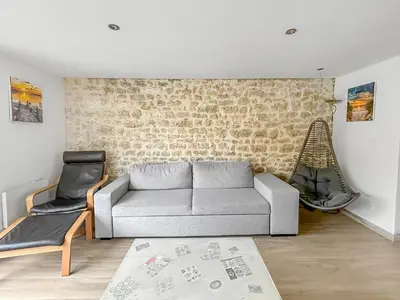Coin salon dans l'établissement Maison familiale traditionnelle avec terrasse