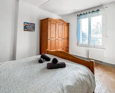 Un ou plusieurs lits dans un hébergement de l'établissement Maison familiale traditionnelle avec terrasse