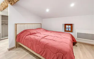 Un ou plusieurs lits dans un hébergement de l'établissement Charmante Maison