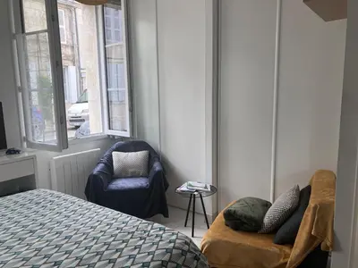 Un ou plusieurs lits dans un hébergement de l'établissement Centre ville studio meublé de tourisme classé 2 étoiles