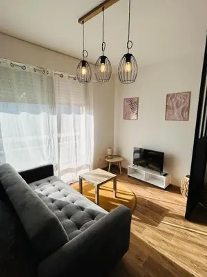 Coin salon dans l'établissement Bel Air Appartement