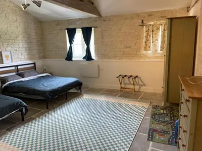 Un ou plusieurs lits dans un hébergement de l'établissement La Maison du Petit Jacques - Rose Cottage