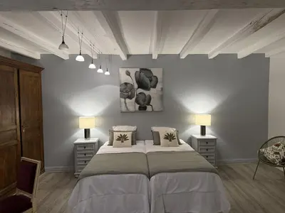 Un ou plusieurs lits dans un hébergement de l'établissement Belle Demeure Charentaise - Piscine chauffée