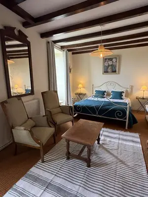 Un ou plusieurs lits dans un hébergement de l'établissement Belle Demeure Charentaise - Piscine chauffée
