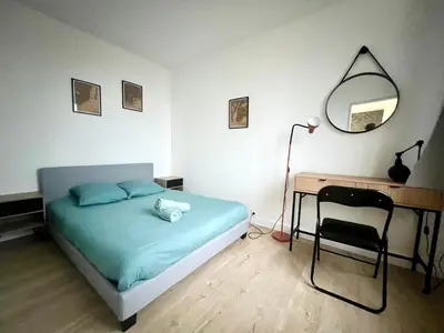 Un ou plusieurs lits dans un hébergement de l'établissement Appartement calme Proche du Centre - 2 chambres - Wifi gratuit