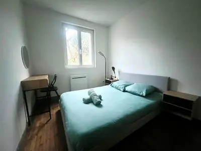 Un ou plusieurs lits dans un hébergement de l'établissement Appartement calme Proche du Centre - 2 chambres - Wifi gratuit