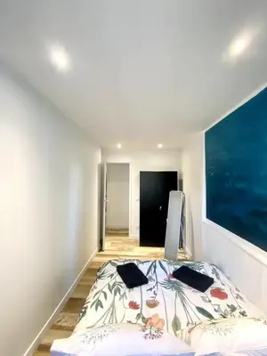 Un ou plusieurs lits dans un hébergement de l'établissement Appartement de Charme Plein Centre-ville de La Rochelle à 2 pas du Marché