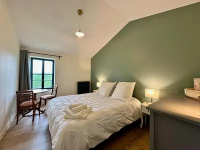Un ou plusieurs lits dans un hébergement de l'établissement Villa Lucienne, maison de charme à la campagne