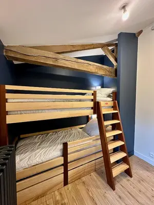 Un ou plusieurs lits dans un hébergement de l'établissement Villa Lucienne, maison de charme à la campagne