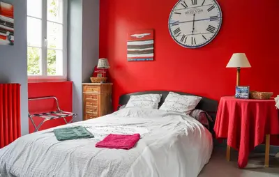 Un ou plusieurs lits dans un hébergement de l'établissement Charmante Maison Au Calme