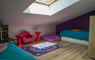 Un ou plusieurs lits dans un hébergement de l'établissement Charmante Maison Au Calme