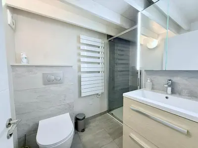 Salle de bains dans l'établissement Le Bord de Plage