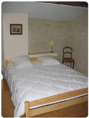 Un ou plusieurs lits dans un hébergement de l'établissement Maison SAINT AMANT DE BOIXE