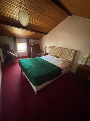Un ou plusieurs lits dans un hébergement de l'établissement Gîte à la ferme - 10 personnes