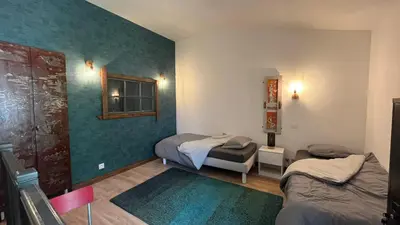 Un ou plusieurs lits dans un hébergement de l'établissement L'Annexe, Maison avec jardin proche Futuroscope