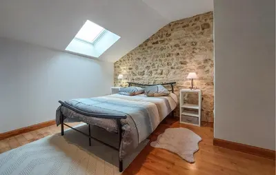 Un ou plusieurs lits dans un hébergement de l'établissement Charmante Maison À La Campagne