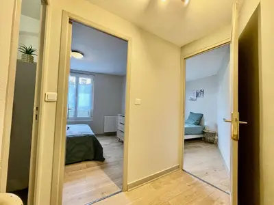Un ou plusieurs lits dans un hébergement de l'établissement Duplex au coeur de ville