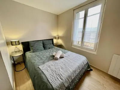 Un ou plusieurs lits dans un hébergement de l'établissement Duplex au coeur de ville