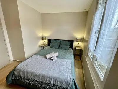 Un ou plusieurs lits dans un hébergement de l'établissement Duplex au coeur de ville