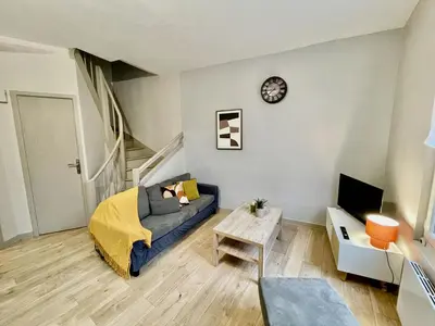 Télévision ou salle de divertissement dans l'établissement Duplex au coeur de ville