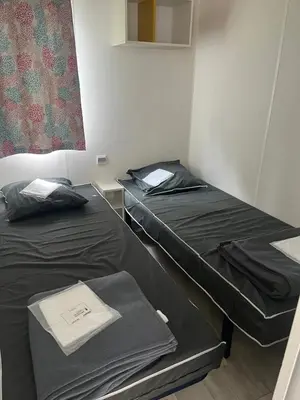 Un ou plusieurs lits dans un hébergement de l'établissement Camping 3 étoiles - Piscine - ccbfa0c
