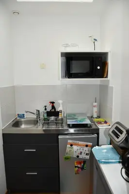 Cuisine ou kitchenette dans l'établissement Studio Sérénité Marine