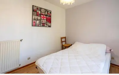 Un ou plusieurs lits dans un hébergement de l'établissement Maison au calme avec jardin cloturé