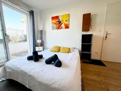 Un ou plusieurs lits dans un hébergement de l'établissement L'Escale Rochelaise avec Terrasse, Aquarium à 5 min