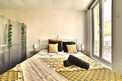 Un ou plusieurs lits dans un hébergement de l'établissement Ave César - Appartement Gallo-Romain en Hypercentre, Fibre, Tv 4K