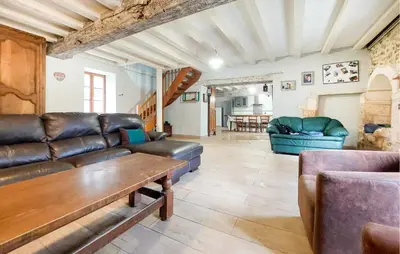Coin salon dans l'établissement Charmante Maison Au Calme