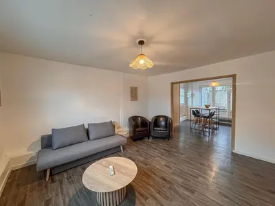 Coin salon dans l'établissement Appartement Neuf 4P - Terrasse - Parking