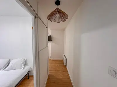 Un ou plusieurs lits dans un hébergement de l'établissement Studio Neuf Centre - Chambre Séparée - Parking