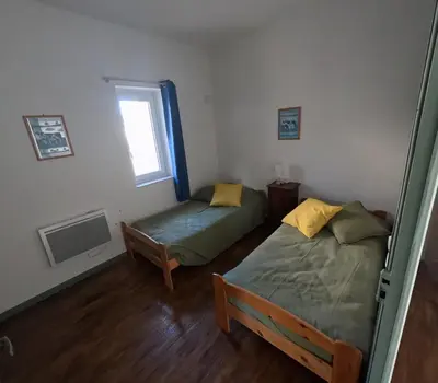 Un ou plusieurs lits dans un hébergement de l'établissement Appartement pour 6 personnes au Vigeant