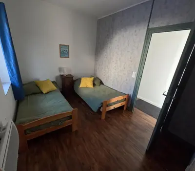 Un ou plusieurs lits dans un hébergement de l'établissement Appartement pour 6 personnes au Vigeant