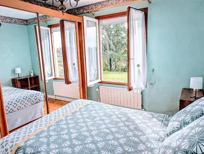 Un ou plusieurs lits dans un hébergement de l'établissement La VILLA MOUSSE - Maison 4 Ch proche Futuroscope et Aquascope