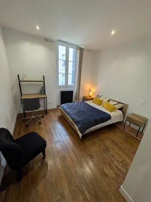 Un ou plusieurs lits dans un hébergement de l'établissement Townhouse in Poitiers Center