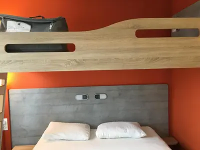 Un ou plusieurs lits dans un hébergement de l'établissement ibis budget Rochefort