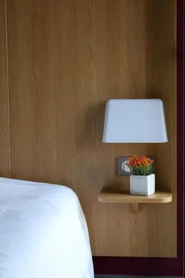 Un ou plusieurs lits dans un hébergement de l'établissement B&B HOTEL La Rochelle Centre 3 étoiles